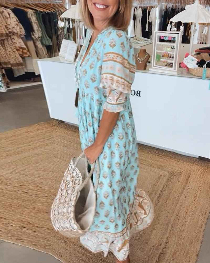 MANA | MIDILANGE CHIQUE FLORALEN JURK MIT V-AUSSCHNITT